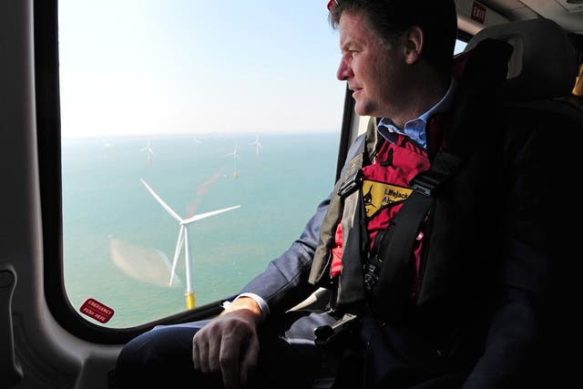 Nick Clegg looks out of a helicopter window over the new Centrica Energy Lincs offshore wind farm