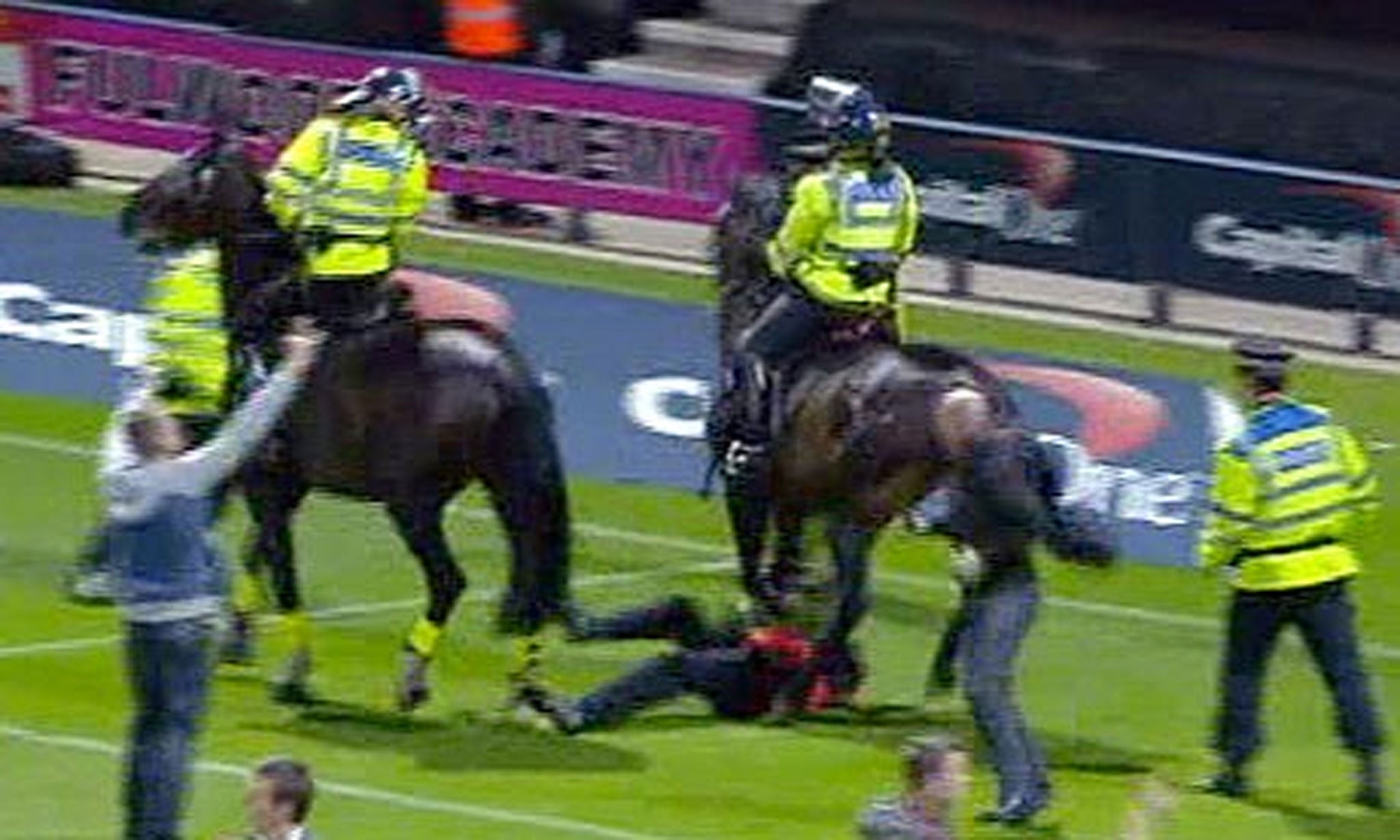 A steward required hospital treatment after being trampled by a police horse during a pitch invasion at a match involving Preston North End and Blackpool.