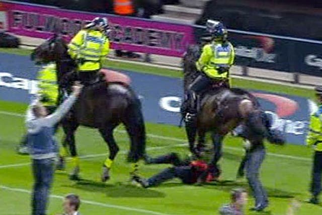 A steward required hospital treatment after being trampled by a police horse during a pitch invasion at a match involving Preston North End and Blackpool.