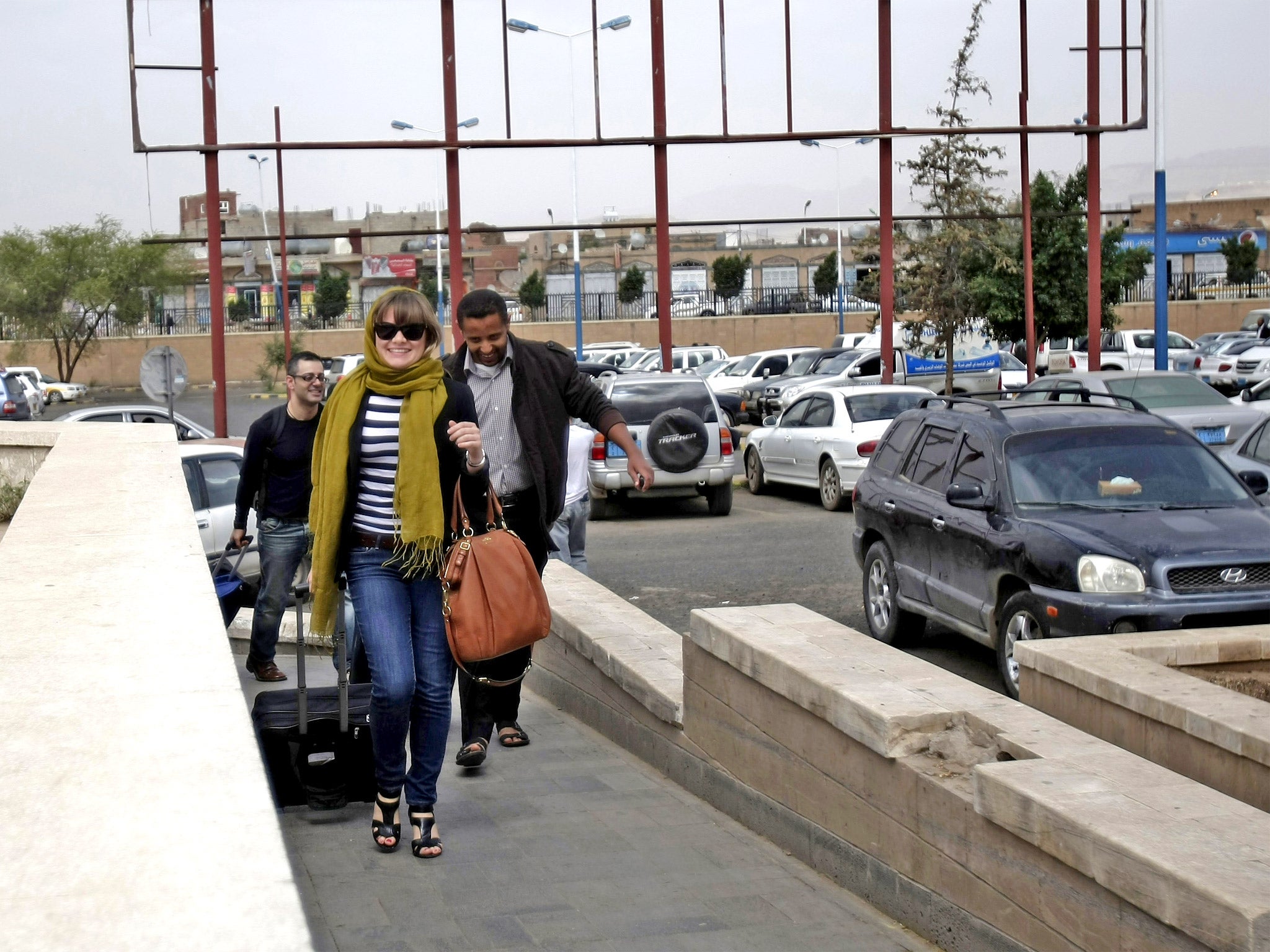 Travelers make their way to the departure lounge at Sanaa