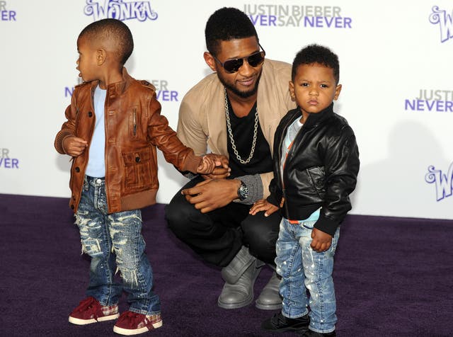 Usher pictured with his two sons by Tameka Foster at a film premiere in 2011. His five-year-old son Usher Raymond V has been taken to hospital after nearly drowning in Atlanta.