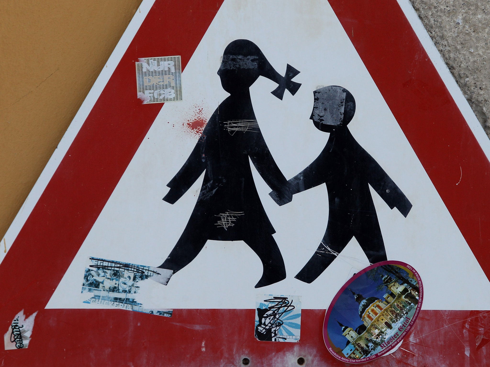 A traffic sign depicting children is pictured at the Benedictine-run Ettal Monastery is pictured on March 12, 2010 in Ettal, Germany.