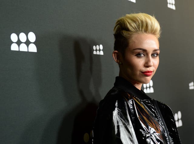 Miley Cyrus has scored her first UK number one single with "We Can't Stop"