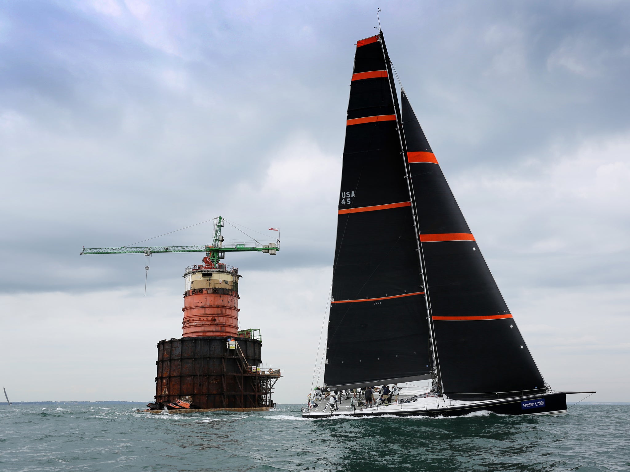 Out on her own, the 72-foot Bella Mente passes Nab Tower on her way to winning the New York Yacht Club Challenge Cup, one of the two top trophies in AAM Cowes Week.