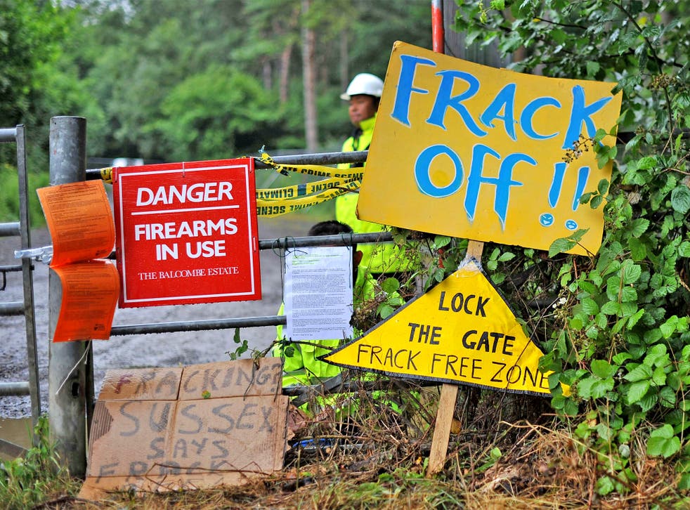 Placards are pictured at the entrance of the drill site