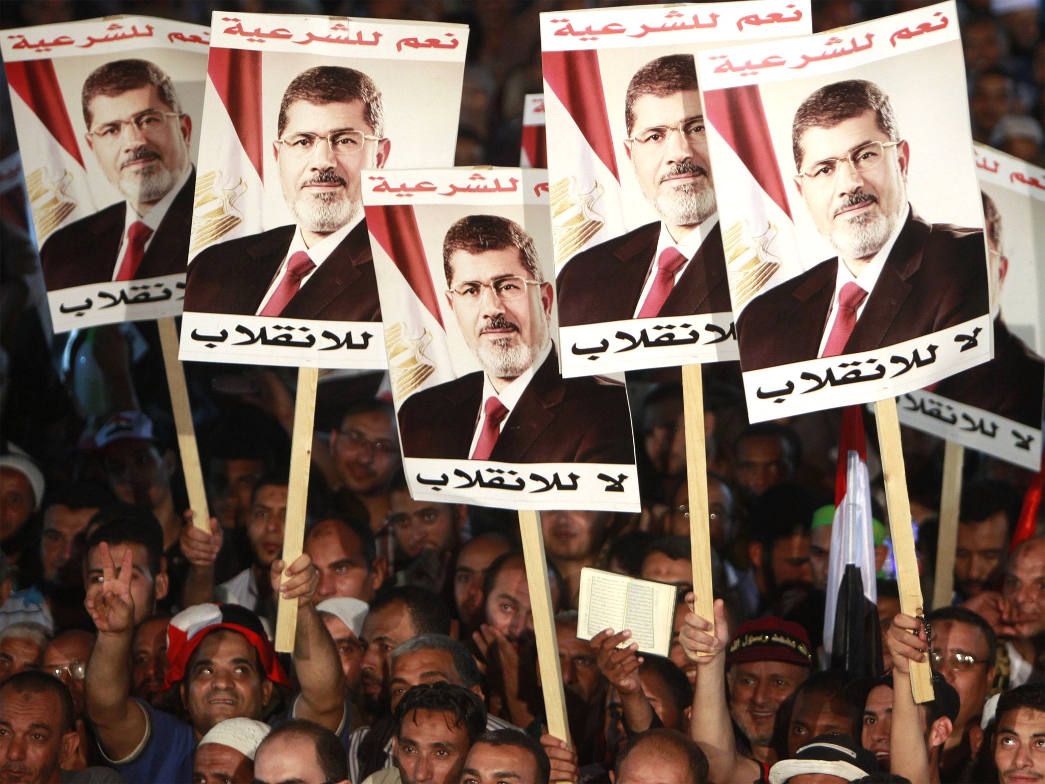 Supporters of deposed President Mohamed Morsi protest at Rabaa al-Adawiya square in Cairo