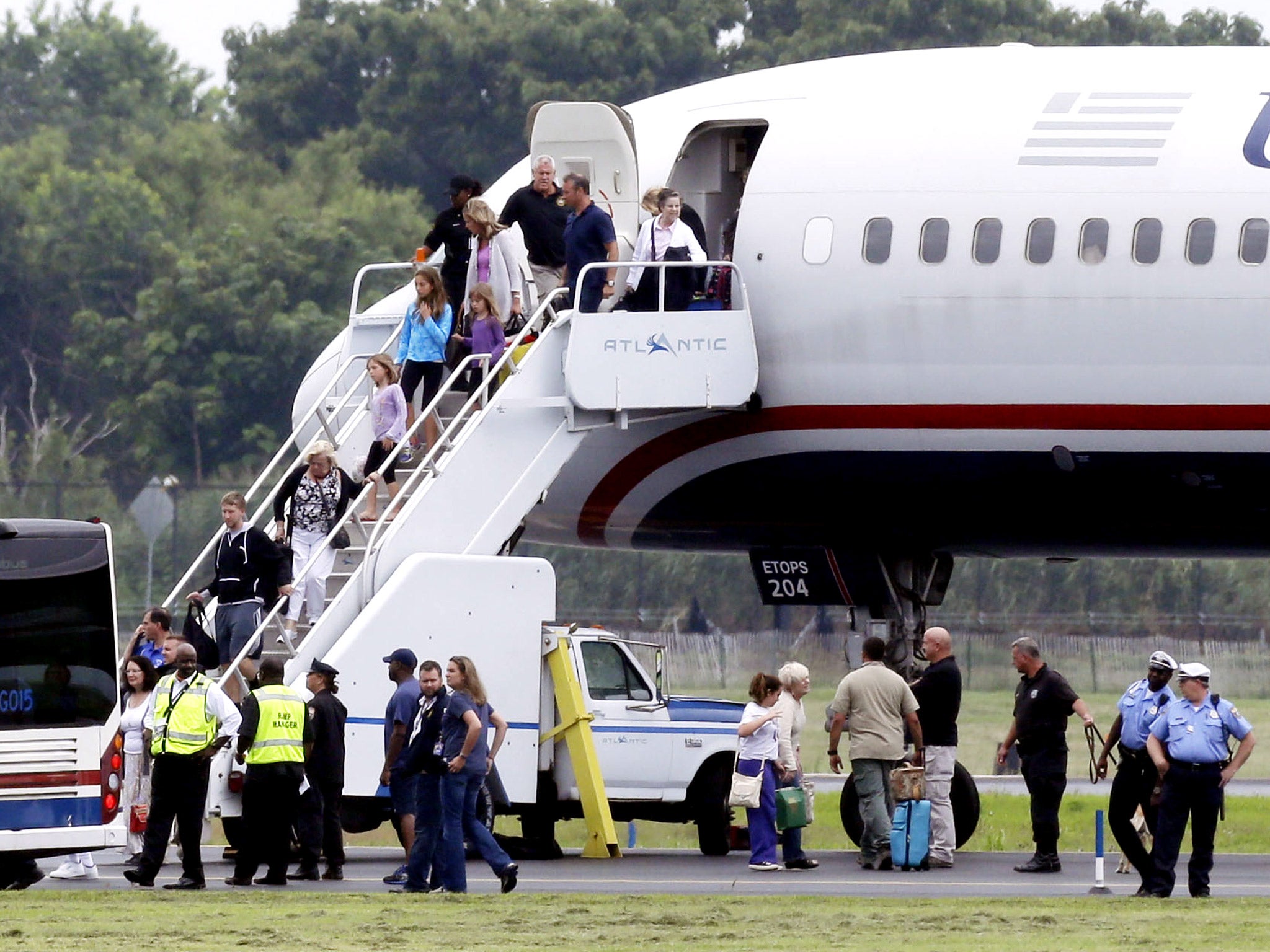 Passengers exit the plane in Philadelphia