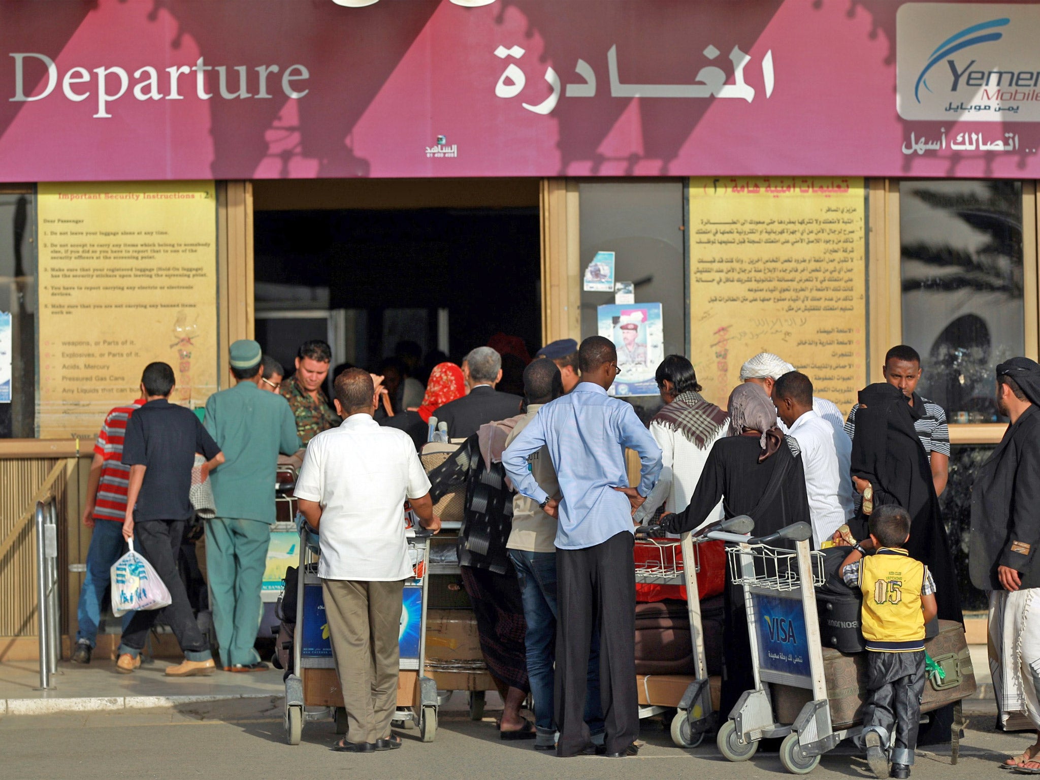 Foreign nationals queue to exit the country (Getty)