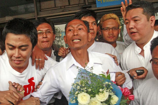 Ko Ko Gyi, a former political prisoner, celebrates with supporters after being released under a Burmese government amnesty last year