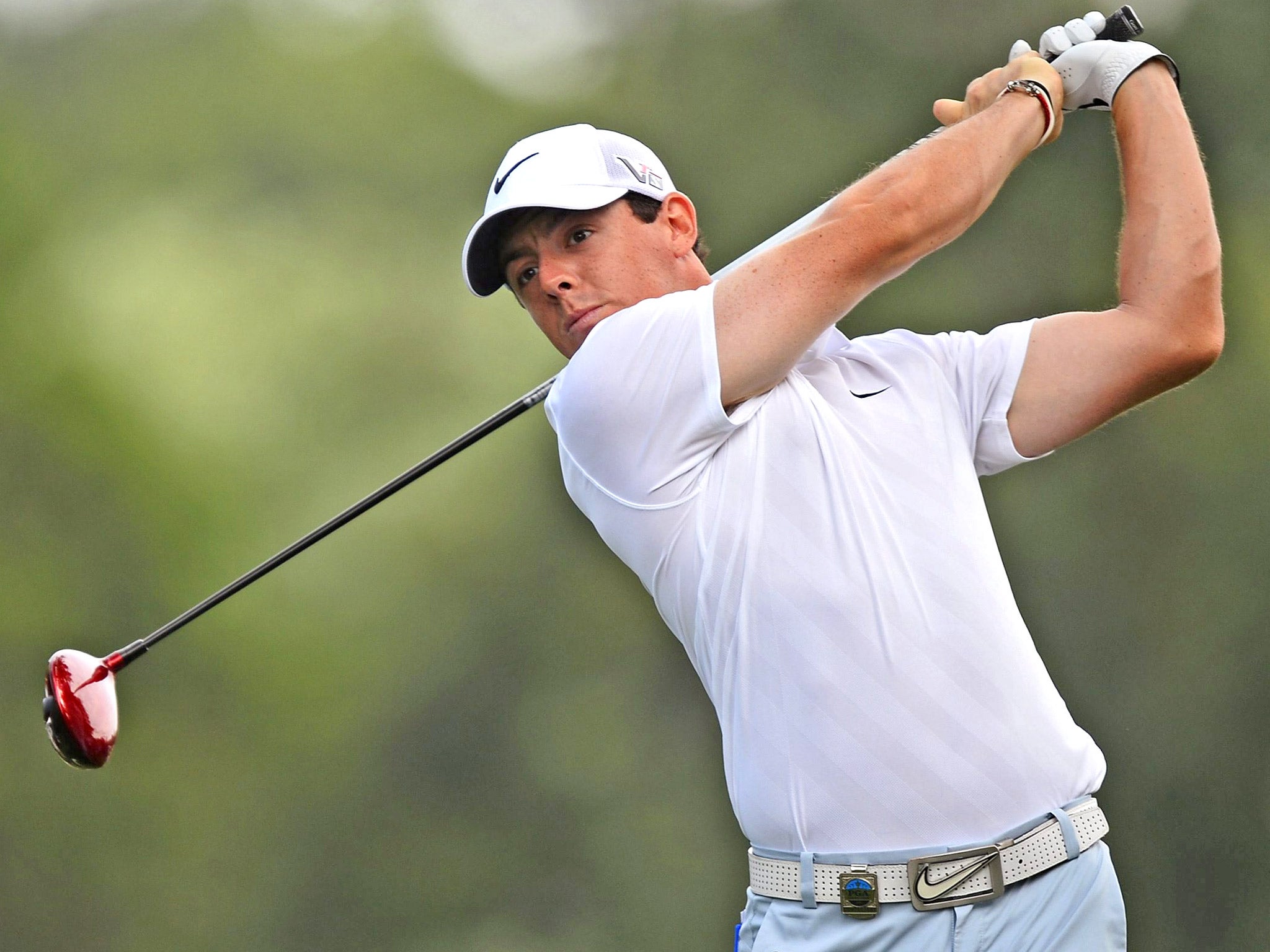 Rory McIlroy hits a tee shot at Oak Hill during practice