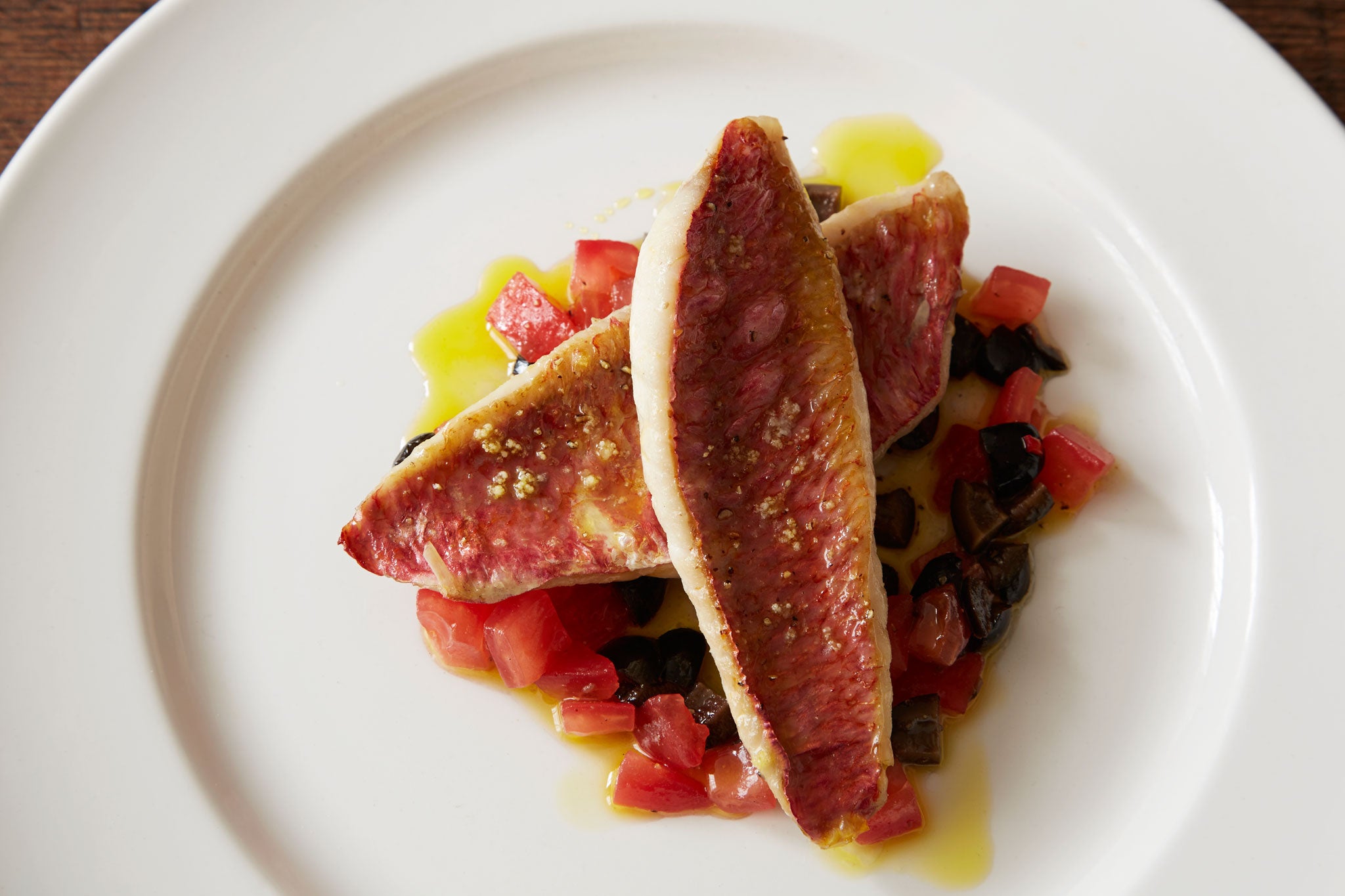 Red mullet with tomatoes and black olives