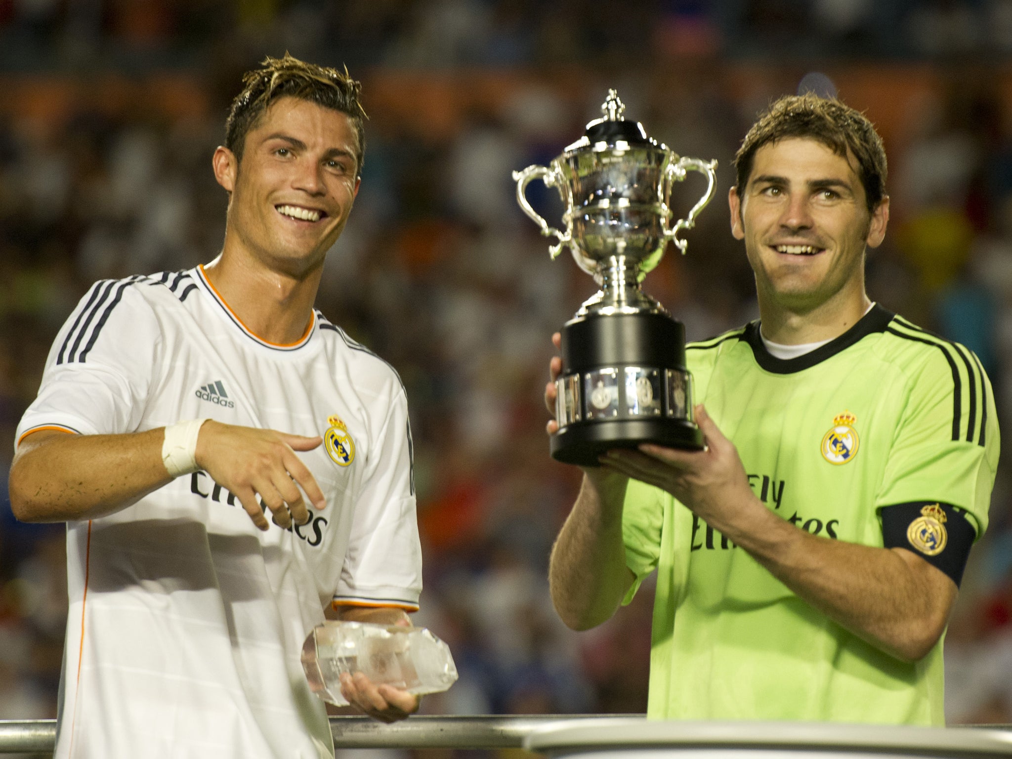 Cristiano Ronaldo and captain Iker Casillas celebrate with the International Champions Cup trophy