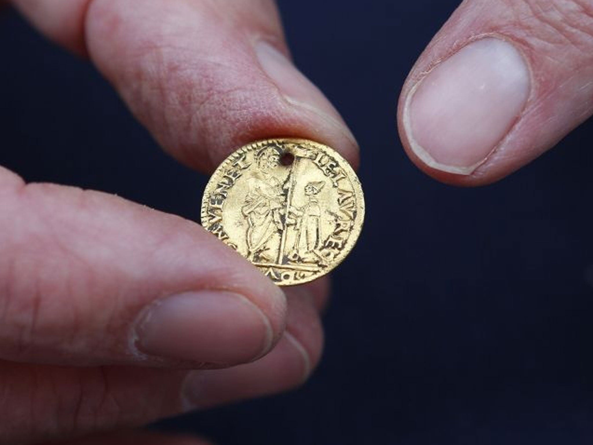 A 16th century Venetian gold coin, perforated to be worn as jewelery