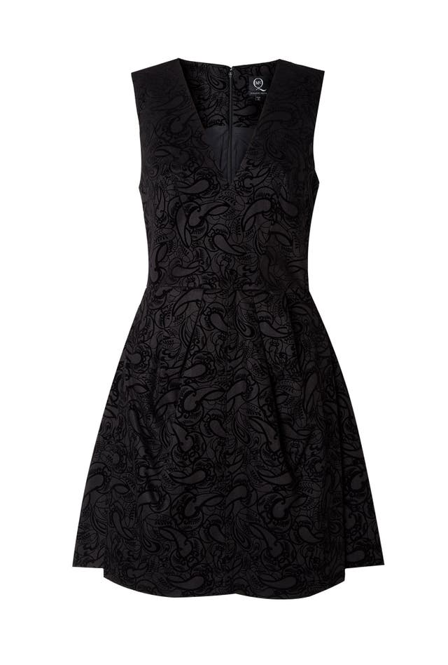 This cocktail dress from McQ Alexander McQueen takes elements of 1970s wallpaper to new heights of chic with its flocked pattern