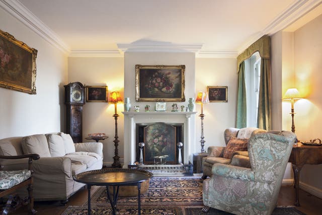 Period piece: The drawing-room, complete with one of Morris's favoured grandfather clocks, is redolent of the 1930s