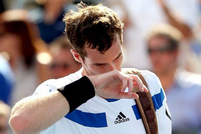 A disappointed Andy Murray leaves the court after his defeat