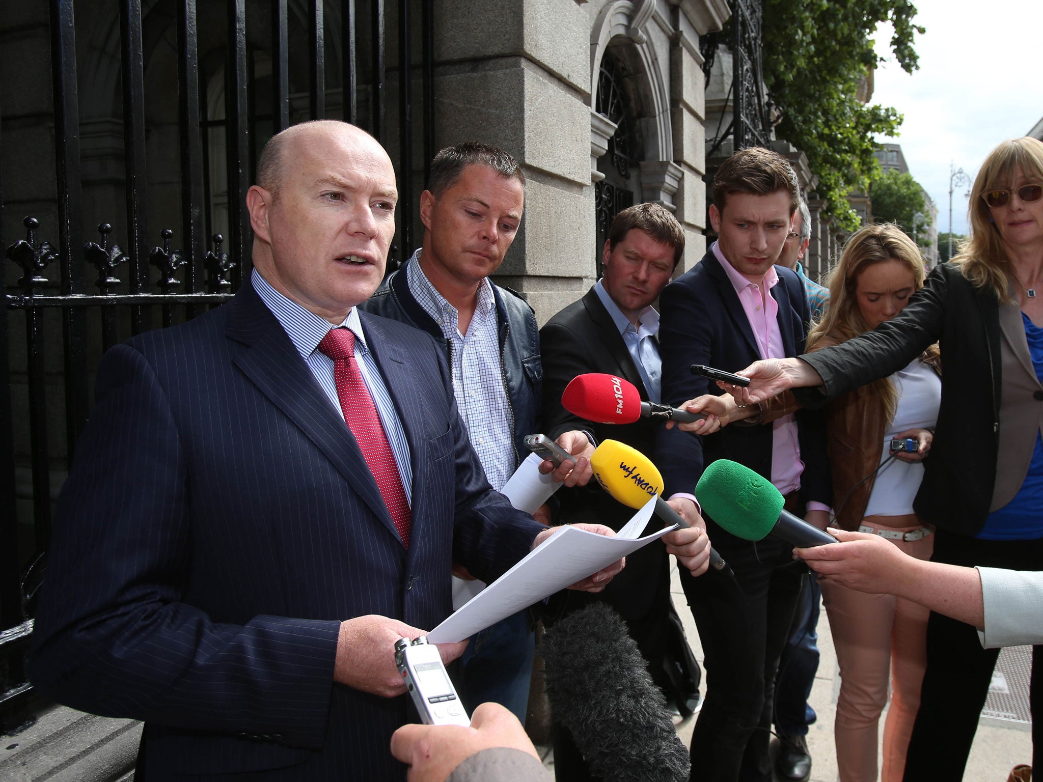 Austin and Oliver Stack (left to right), sons of Brian Stack, make a statement following a series of meetings with Sinn Fein leader Gerry Adams