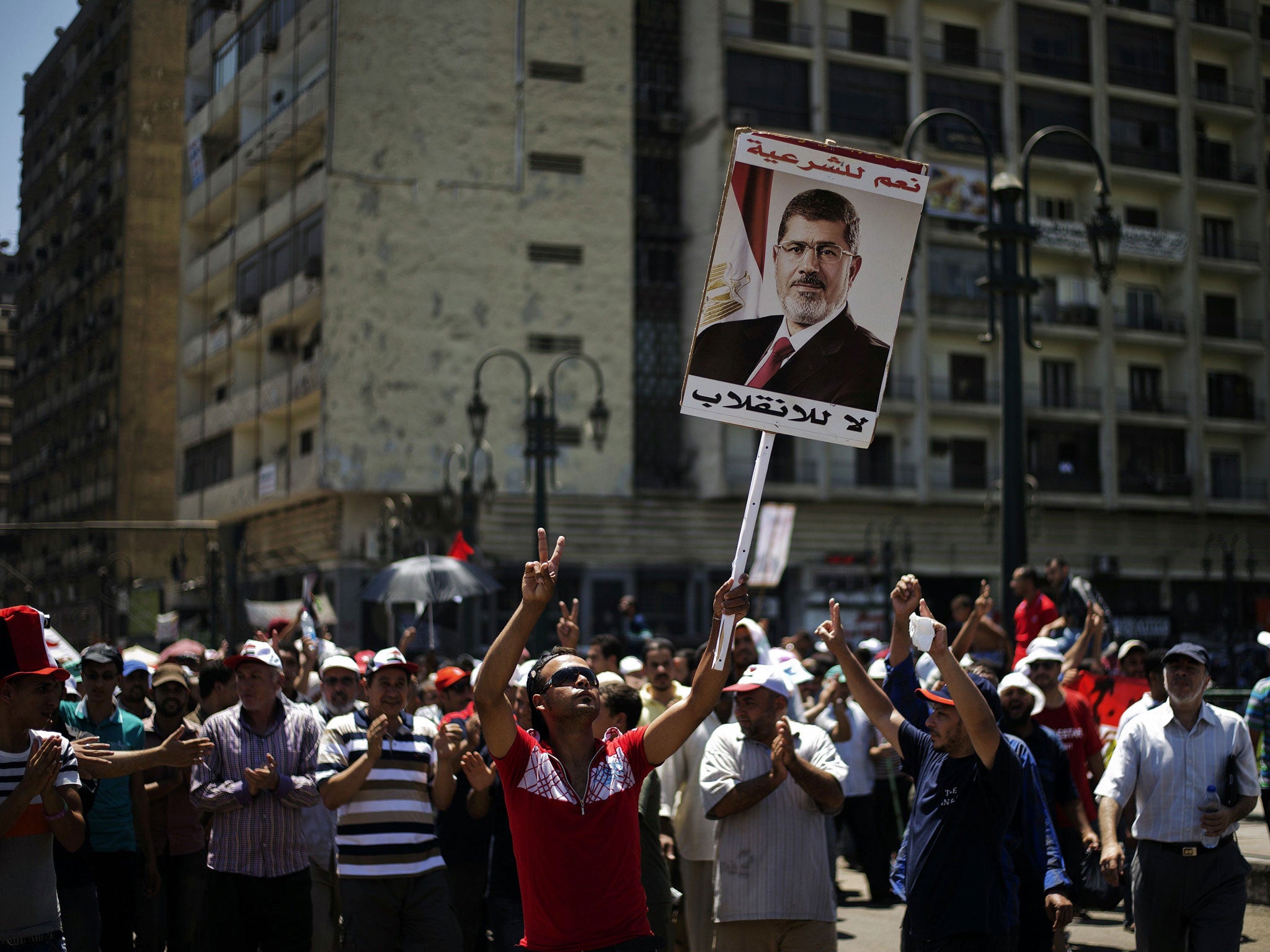 Supporters of the deposed President Mohamed Morsi protest in Cairo yesterday. Rare co-operation between Egypt and Israel saw five suspected Islamic militants killed in the Sinai desert by an Israeli rocket strike