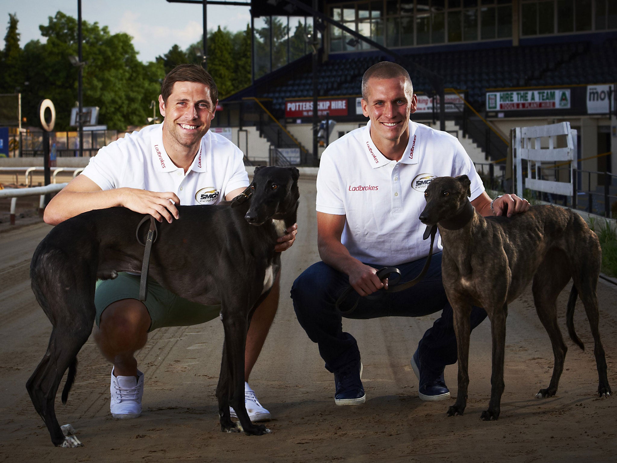 Grant Holt (left) and Steve Morison with their racing greyhounds