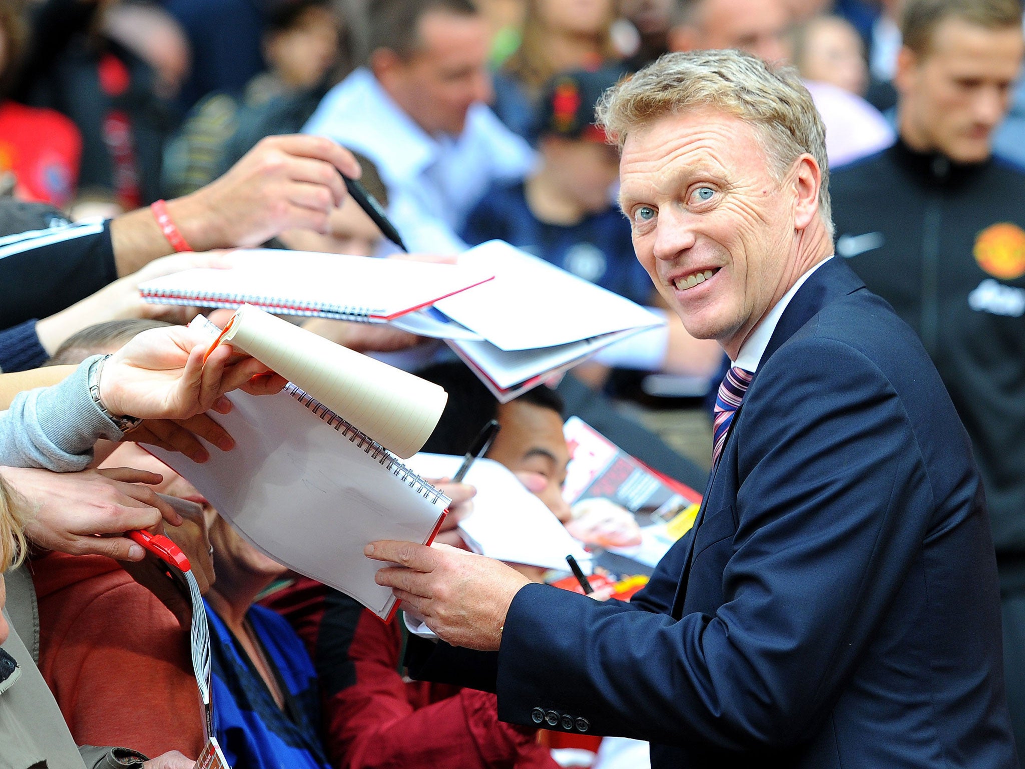 David Moyes signs autographs before the game at Old Trafford