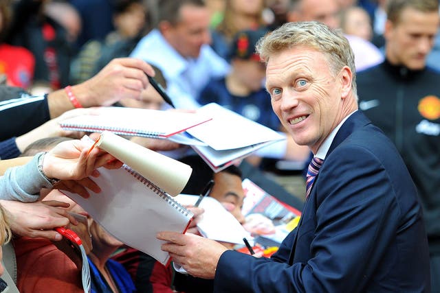 David Moyes signs autographs before the game at Old Trafford