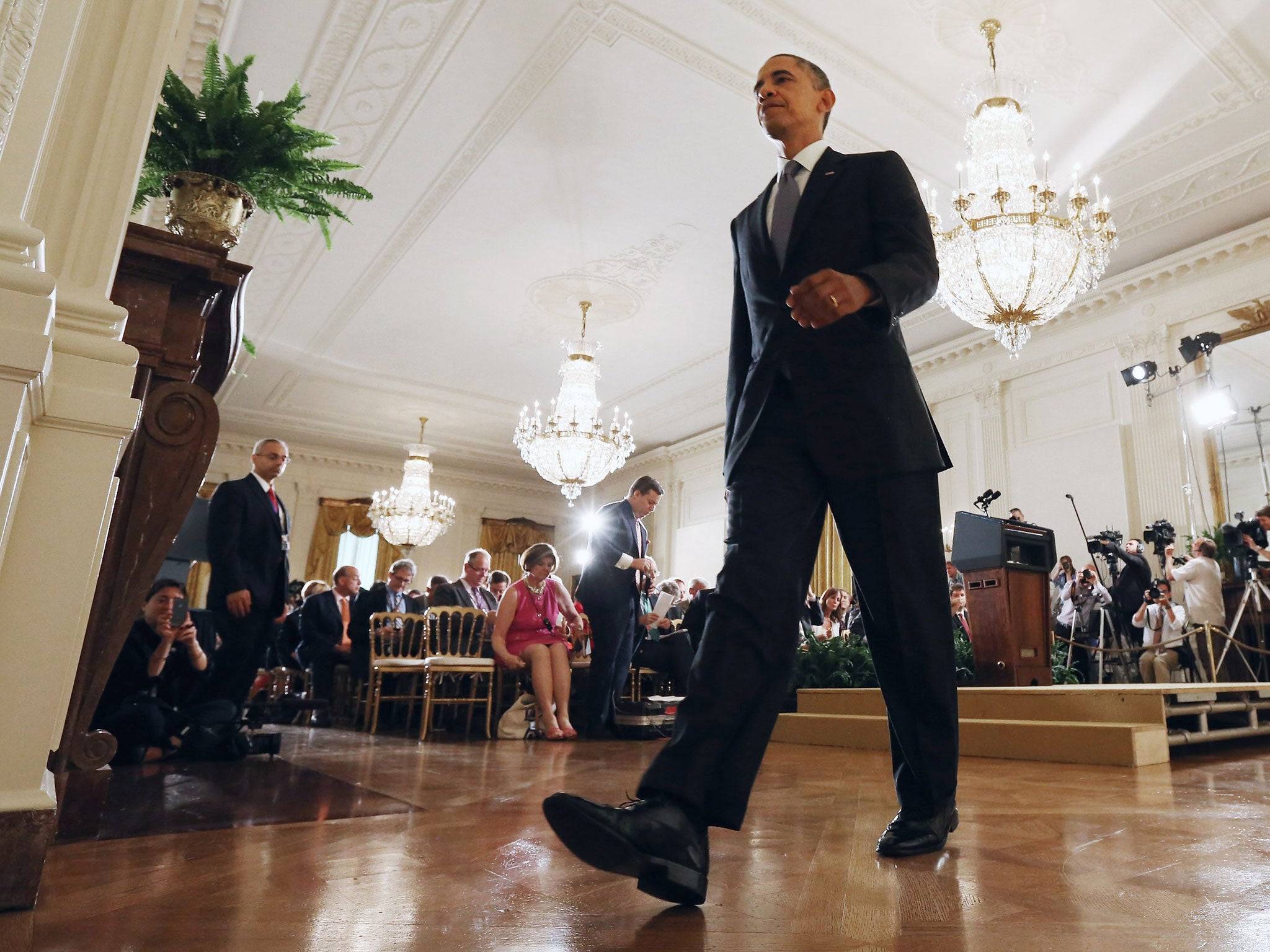 President Obama walks out at the end of his news conference at the White House