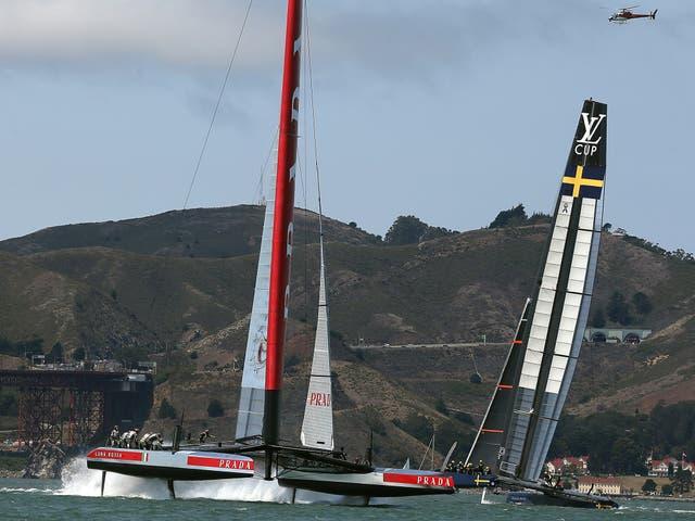 Team Luna Rossa Challenge (L) is skippered by Massimiliano Sirena against Team Artemis Racing (R) skippered by Iain Percy during race three of the Louis Vuitton Cup 