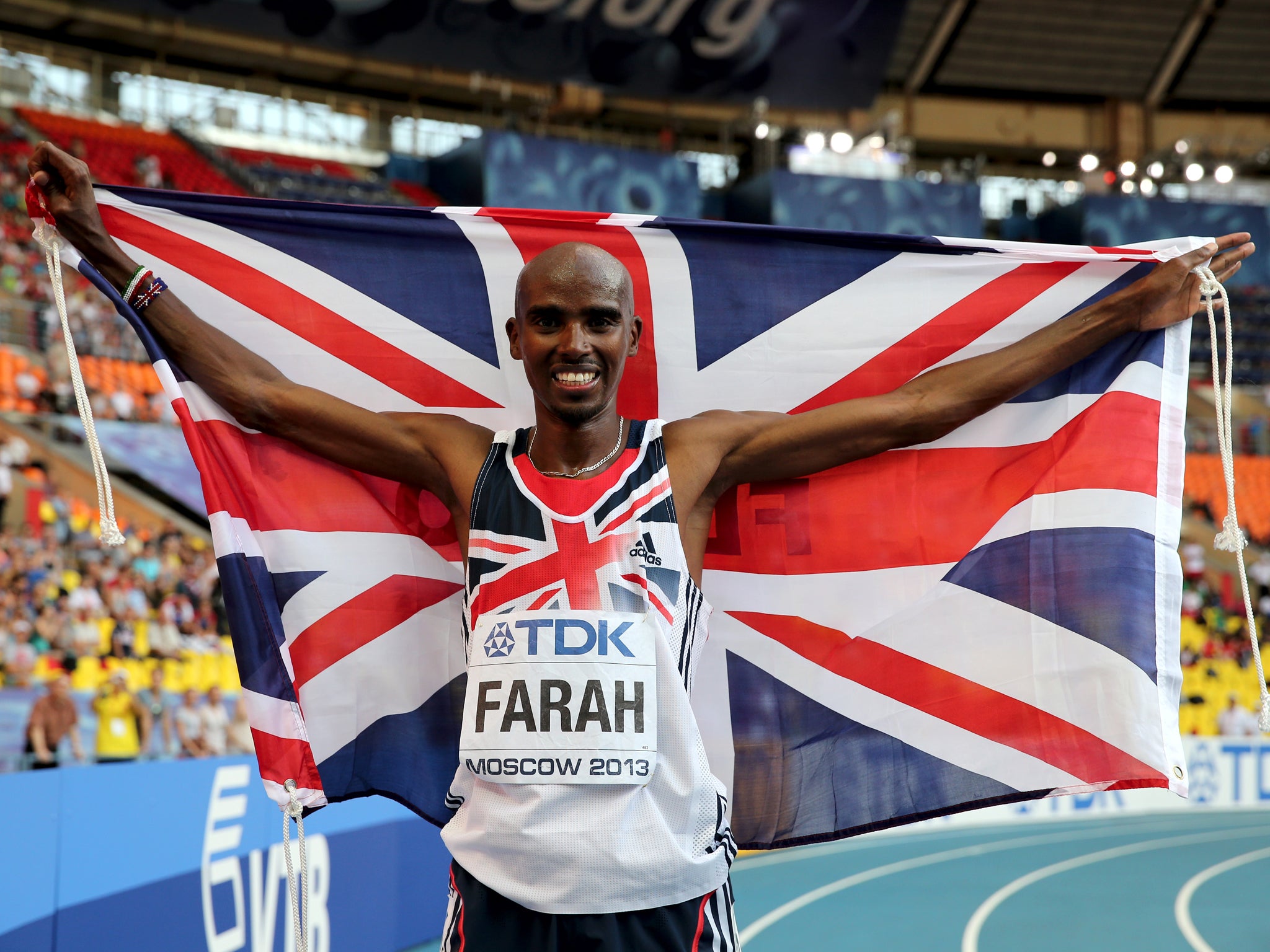 Farah celebrates with the Union Jack after 10,00m World Athletics Championship Gold