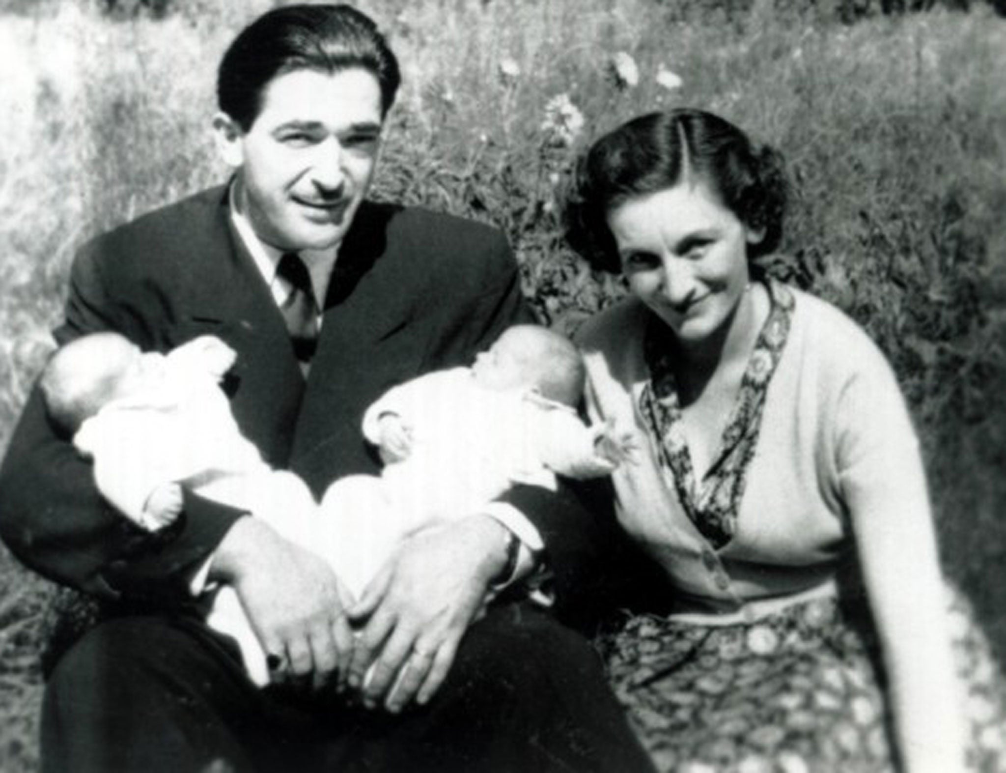 Publicly loyal: Betty Maxwell with her husband Robert and their twin daughters Christine and Isabel at two weeks old in 1950