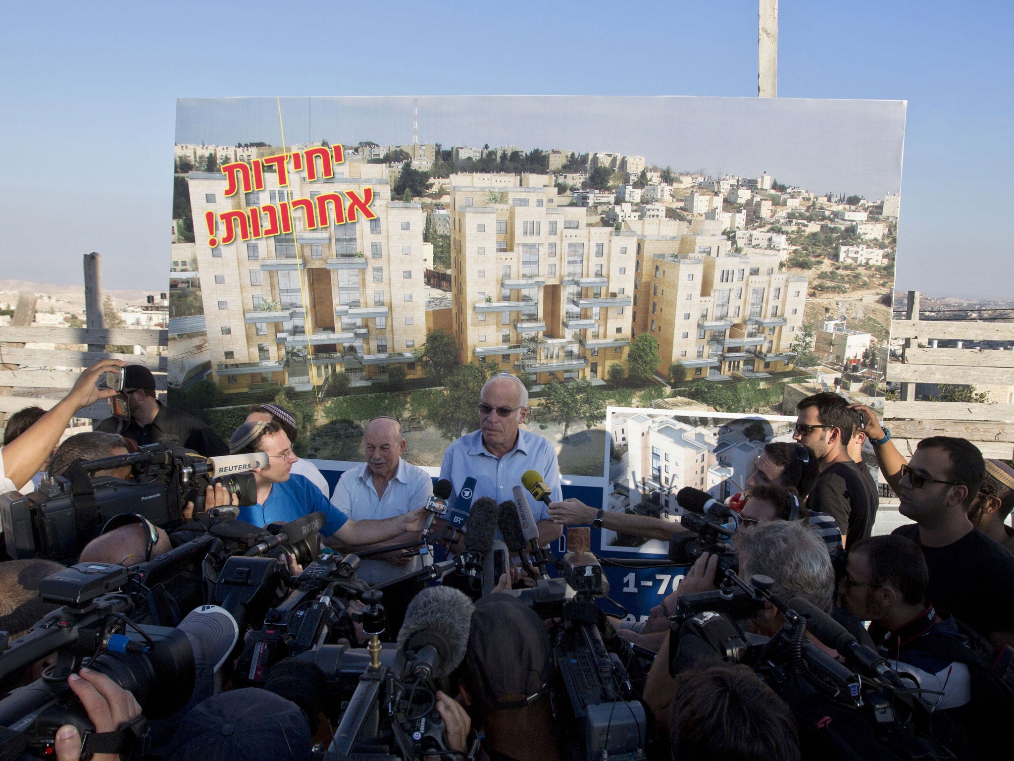 Israel’s housing minister, Uri Ariel, talks to press after the announcement of new settlement units