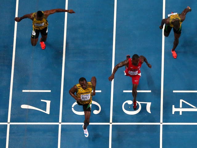 Usain Bolt held off the challenge by American Justin Gatlin, who clocked 9.85secs, with Jamaican Nesta Carter getting bronze in 9.95s