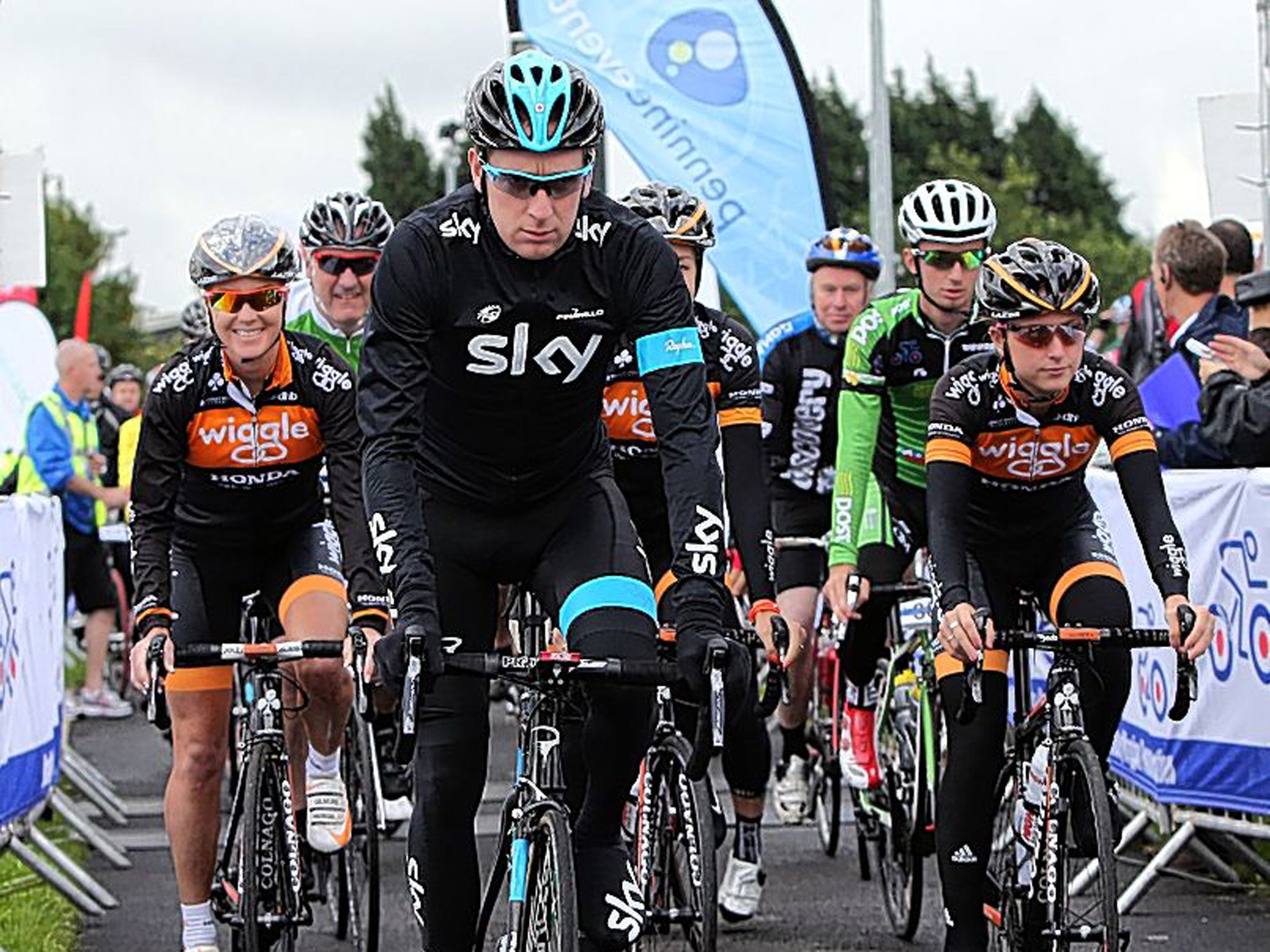 Sir Bradley Wiggins with Dani King (left) and Laura Trott start the Ride With Brad Sportive in Lancashire