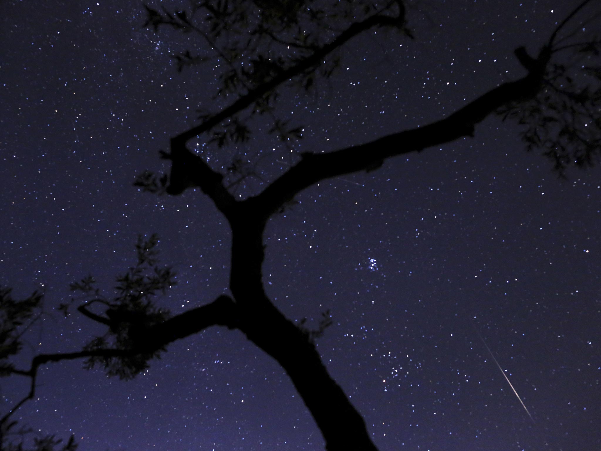 A meteor sparks, lower right, entering the Earth's atmosphere in Greece