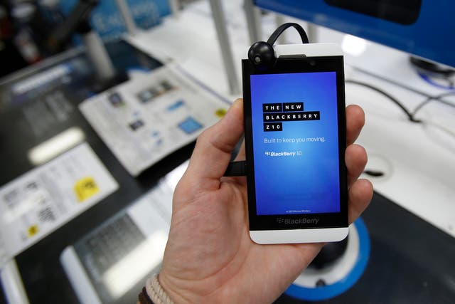 A Blackberry Z10 smartphone is held up in Pasadena, California July 8, 2013. BlackBerry will likely face tough questions about its future at its annual meeting on Tuesday after dismal quarterly results last week triggered a 28 percent plunge in the Canadi
