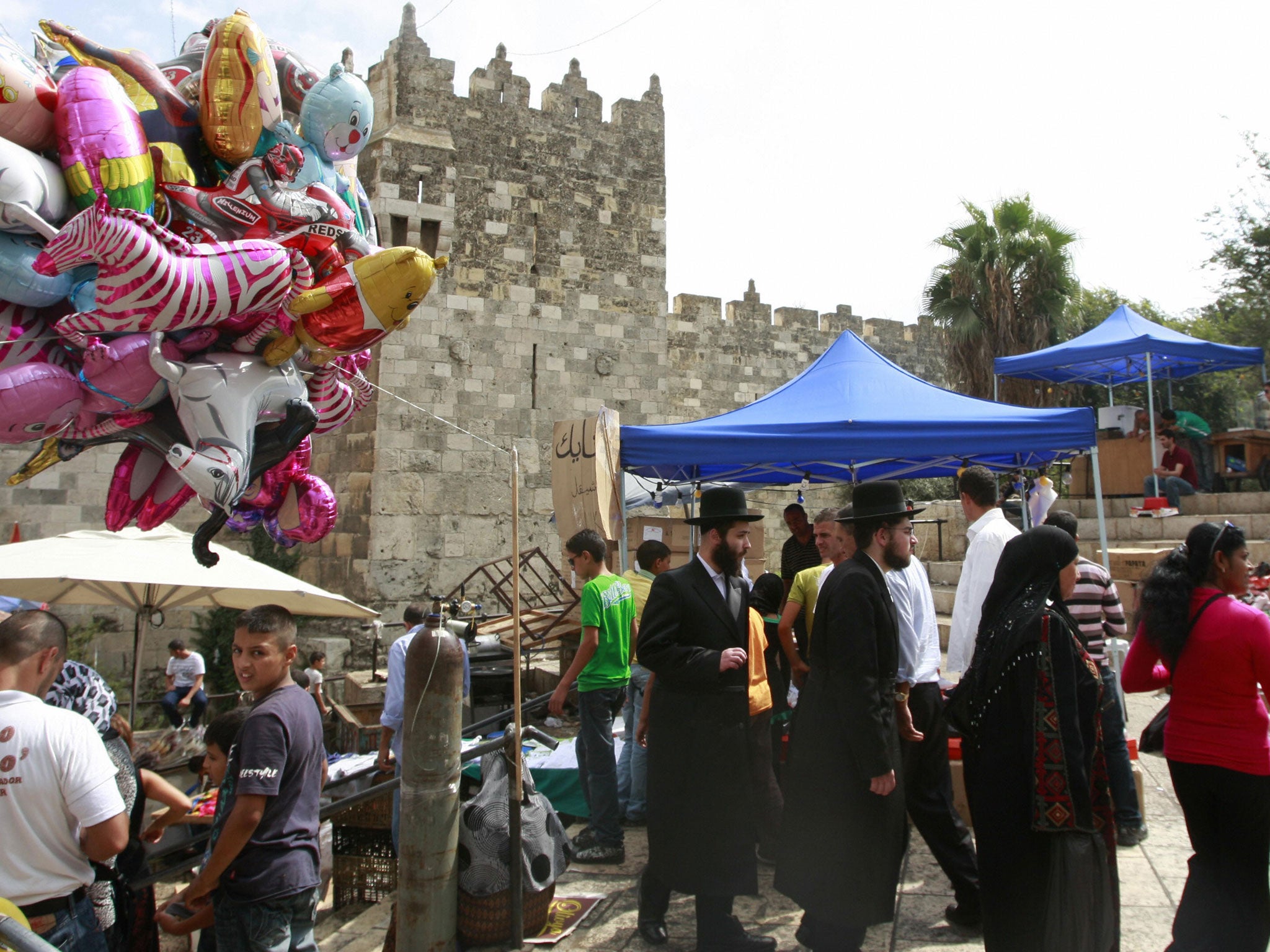 City of hope: Orthodox Jews and Muslims mingle at Damascus Gate in Jerusalem
