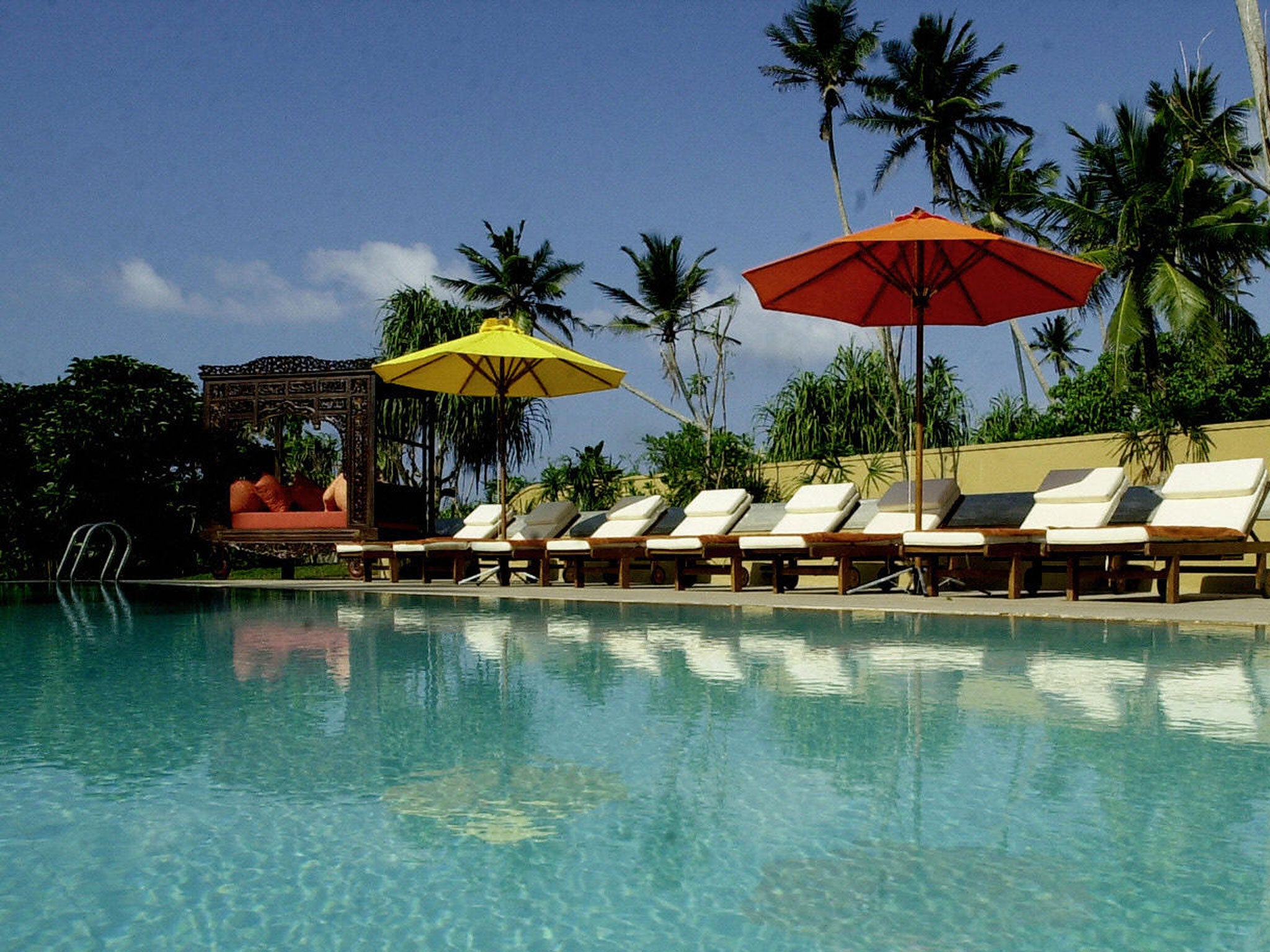 This picture taken 23 December 2005, shows a row of sunloungers beside the swimming pool , awaiting the arrival of tourists at the Adithya Hotel in the coastal town of Ratgama, some 130kms south-east of Colombo