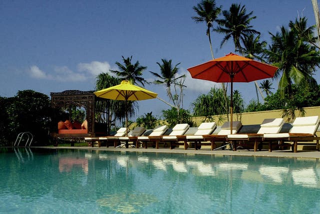 This picture taken 23 December 2005, shows a row of sunloungers beside the swimming pool , awaiting the arrival of tourists at the Adithya Hotel in the coastal town of Ratgama, some 130kms south-east of Colombo