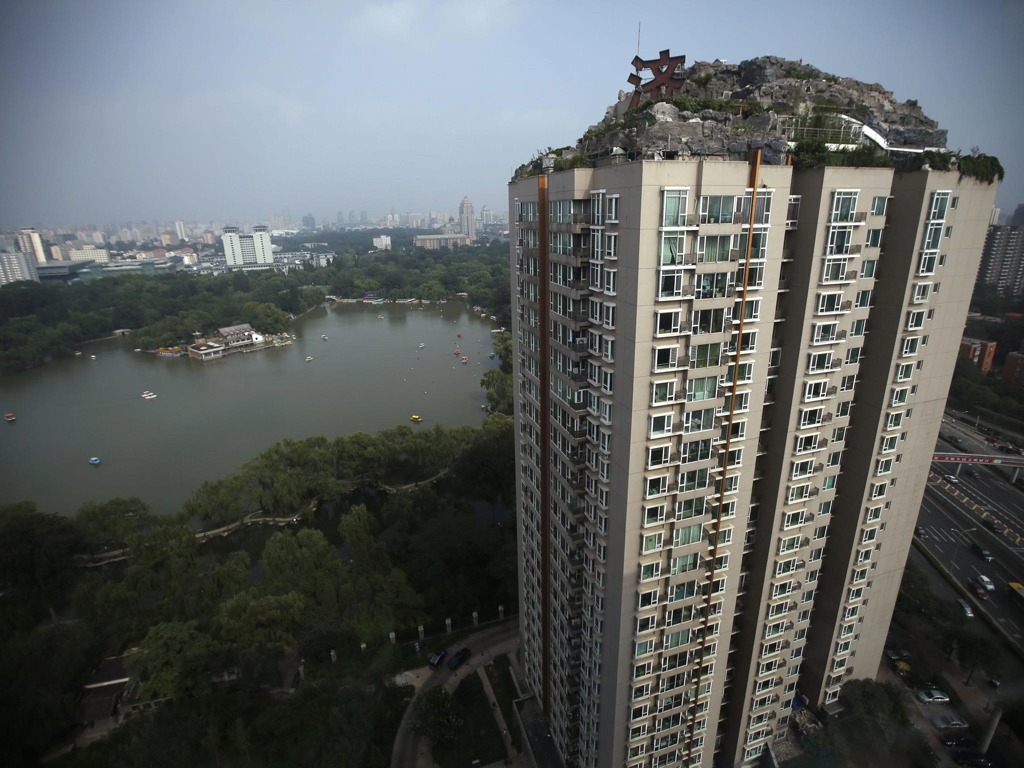 The owner of the villa on top of this building, only known as 'Professor Yang', has been instructed to tear down the illegal building according to property managers