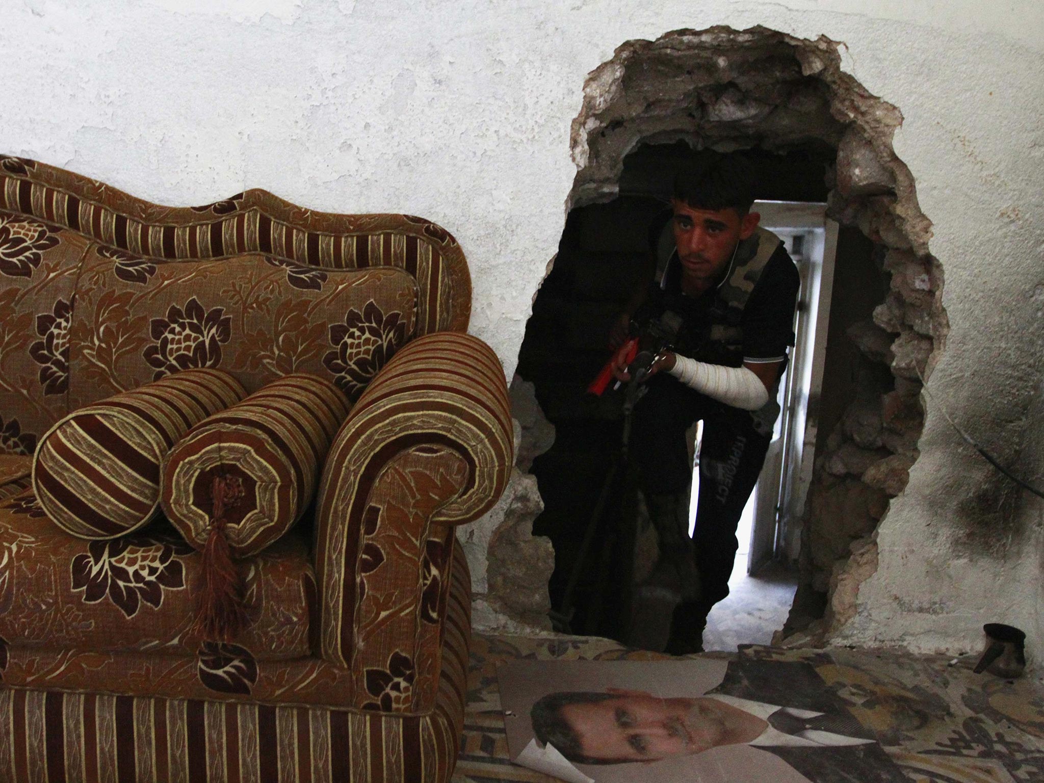 A Free Syrian Army fighter in the old city of Aleppo