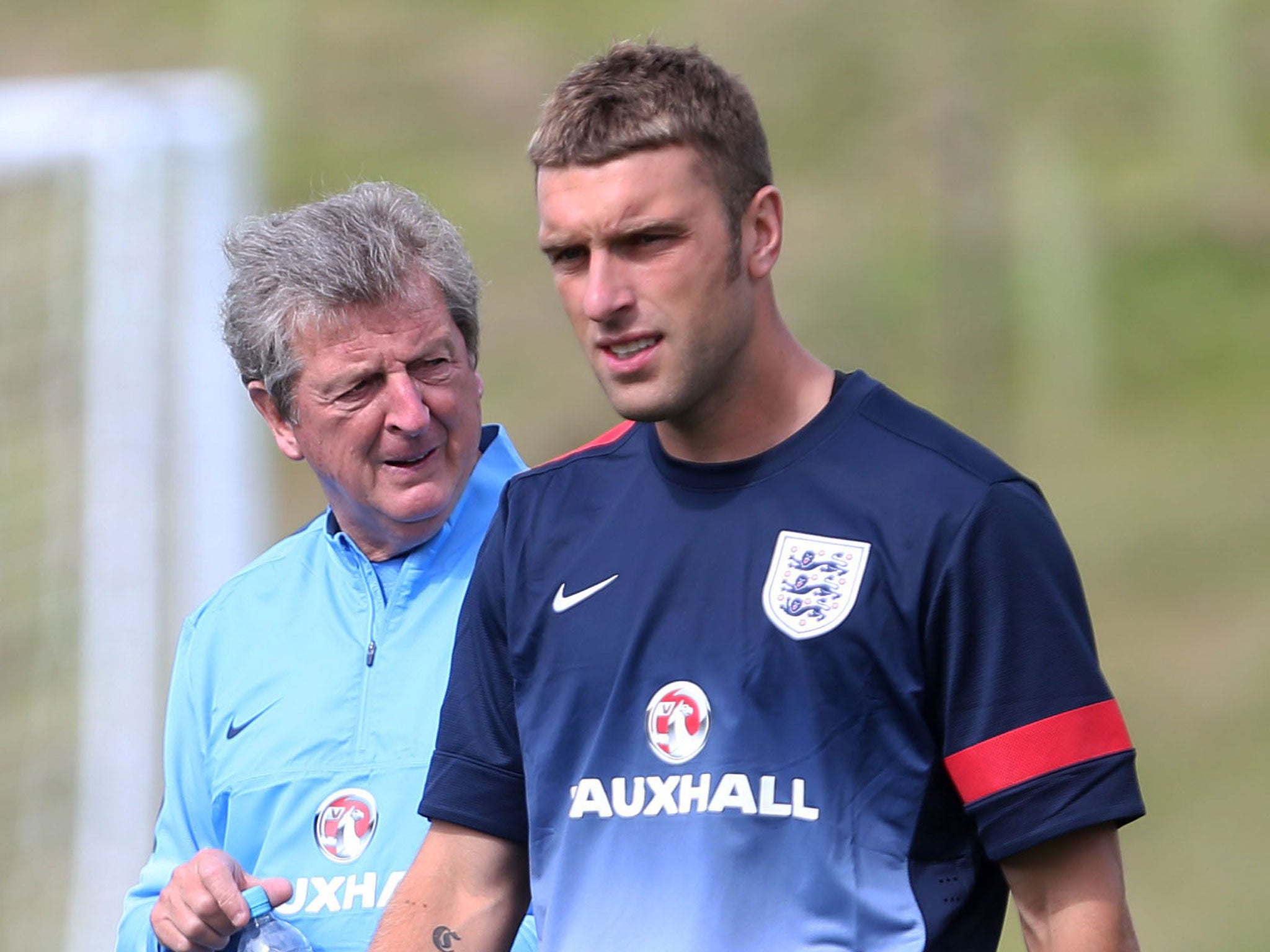 Rickie Lambert trains in front of manager Roy Hodgson