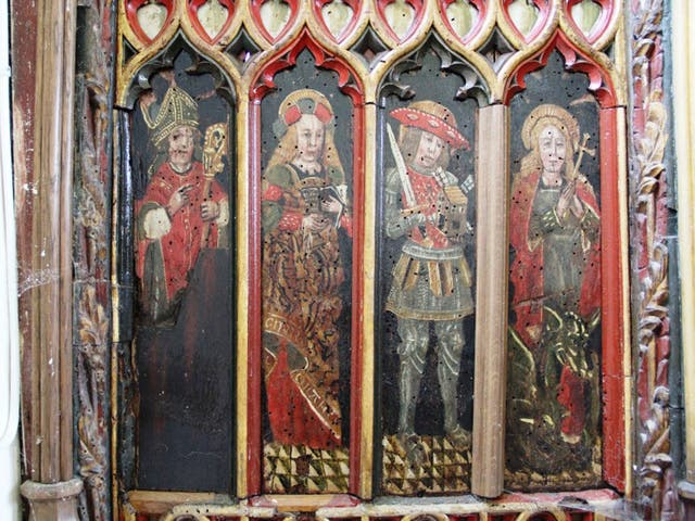 Thieves have hacked out two 15th century panels from a screen in The Holy Trinity Church in Torbryan, Devon.