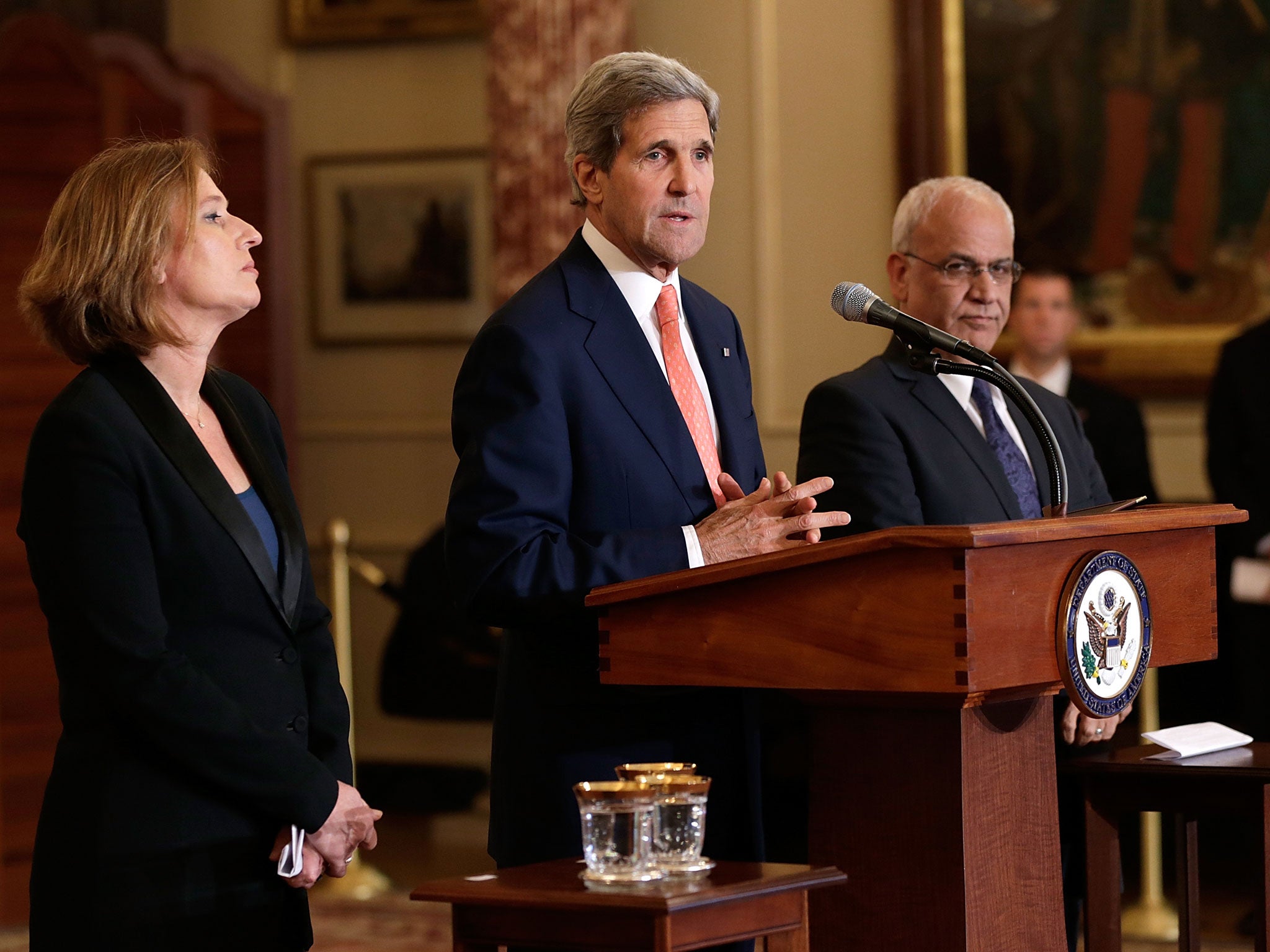 U.S. Secretary of State John Kerry (C) makes a statement with Israeli Justice Minister Tzipi Livni (L) and Palestinian chief negotiator Saeb Erekat (R) during a press conference on the Middle East Peace Process Talks at the Department of State on July 30, 2013 in Washington, DC. Israeli Justice Minister Tzipi Livni and Palestinian chief negotiator Saeb Erekat joined Kerry in some of the first direct talks in three years between Israel and Palestine.