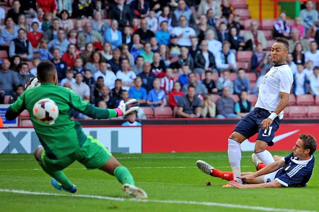 Nathan Redmond beats Jordan Archer to score the first of England Under-21s’ six goals against Scotland at Bramall Lane