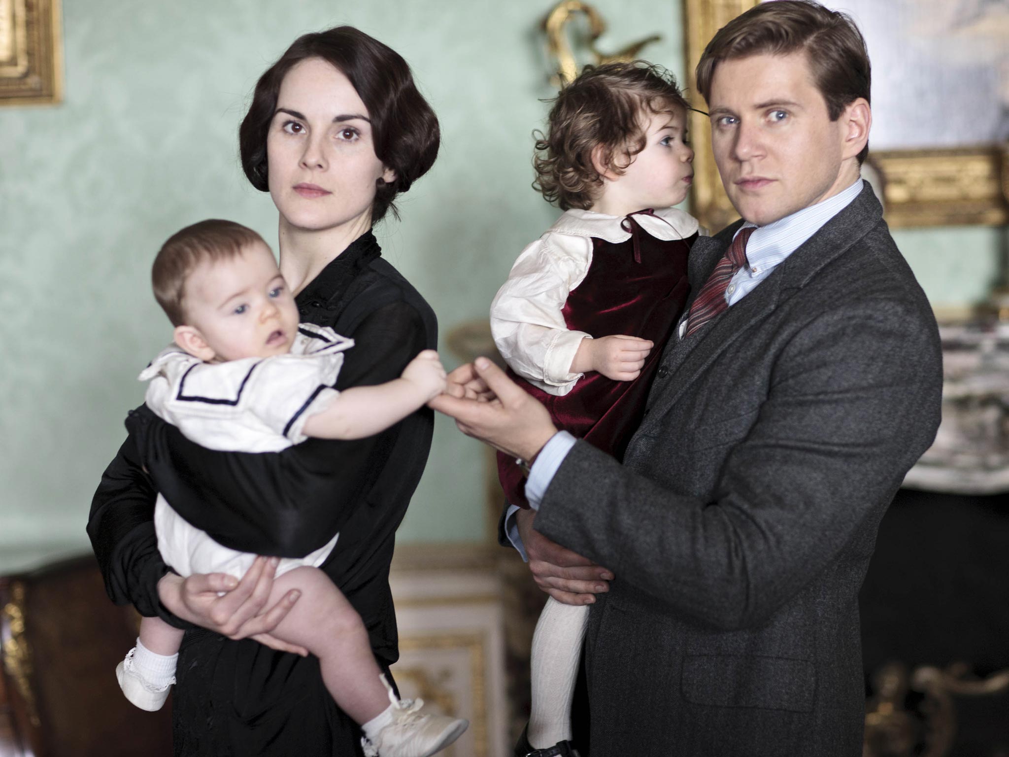 Lady Mary played by Michelle Dockery with Baby George and Tom Branson played by Allen Leech with baby Sybbie