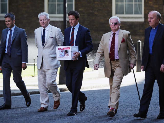 The great-grandson of Winston Churchill, Alexander Perkins (centre) arrives in Downing Street to deliver a petition