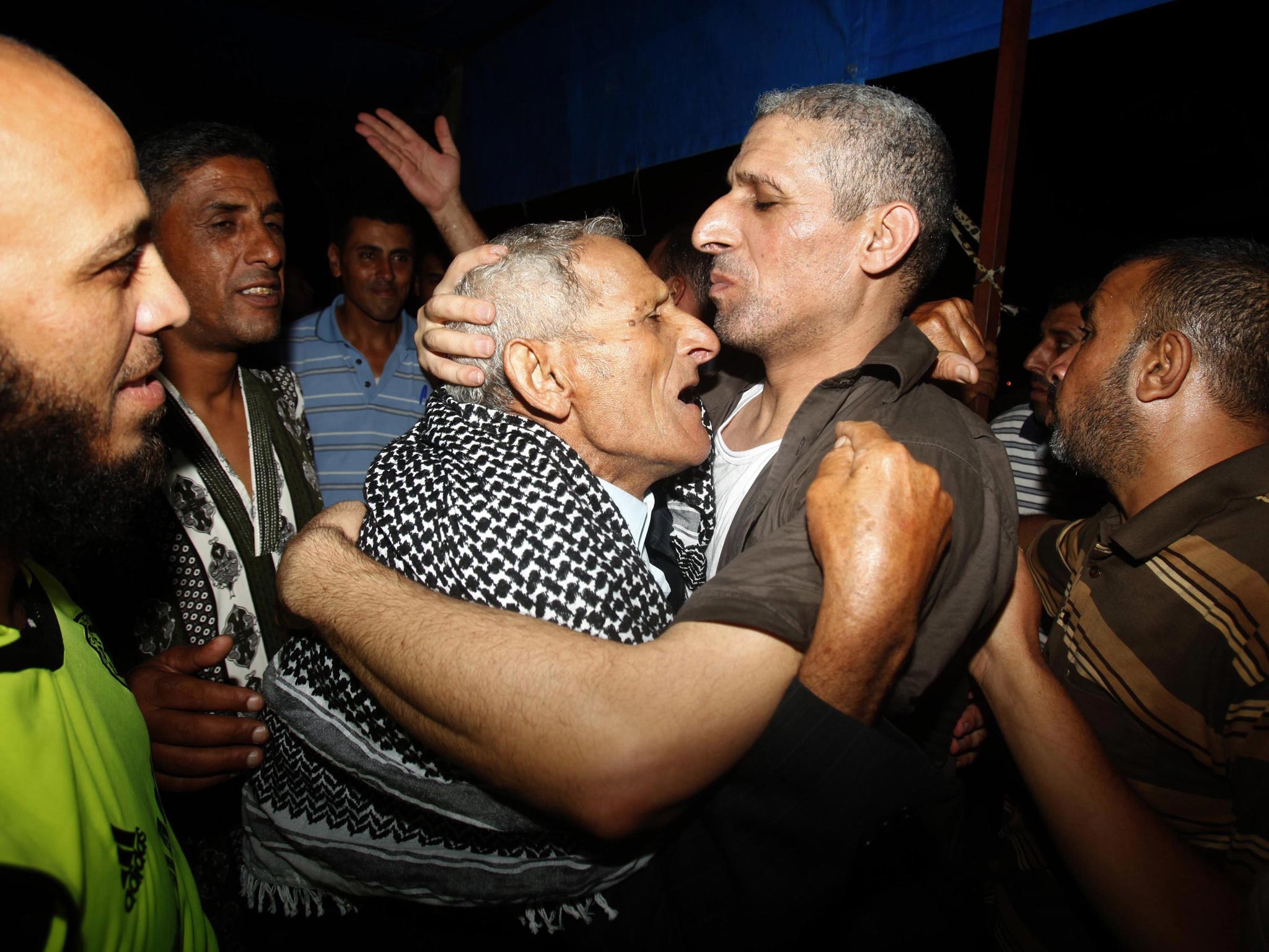 Freed Palestinian prisoner Ateya Abu Moussa (3rd R) was held by Israel for 20 years