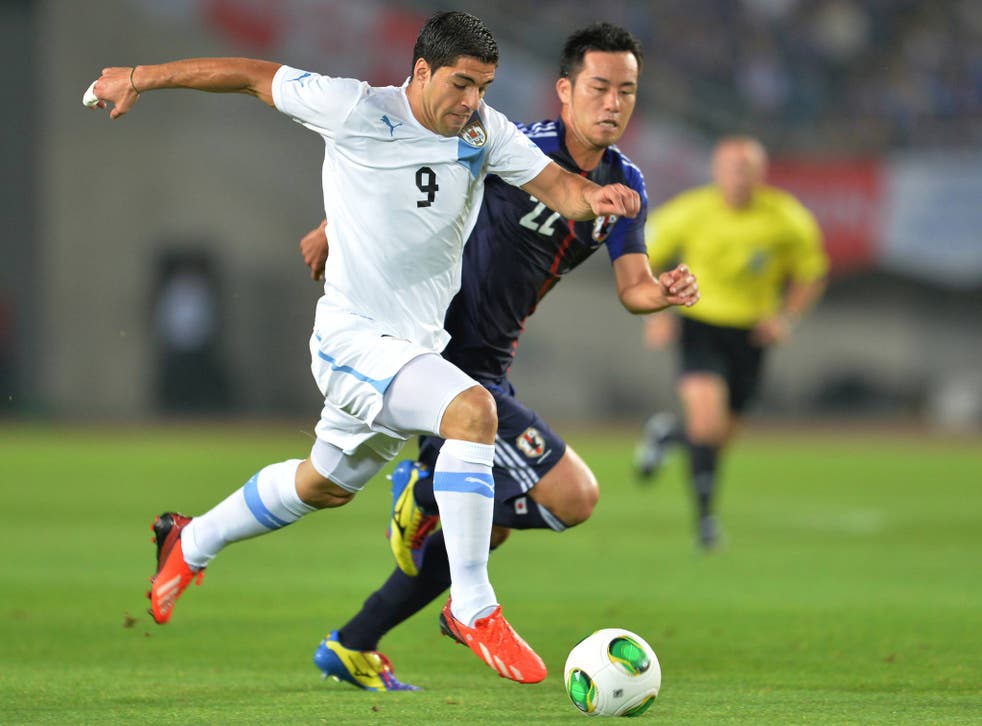 Luis Suarez in action for Uruguay against Japan