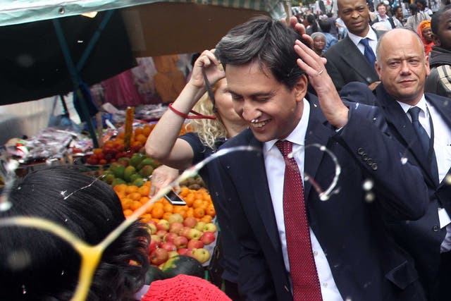 Labour leader Ed Miliband after he was pelted with eggs during a campaign visit in East Street market