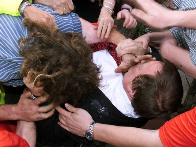 Former Deputy Prime Minister John Prescott scuffles with his egg-chucking attacker in 2001