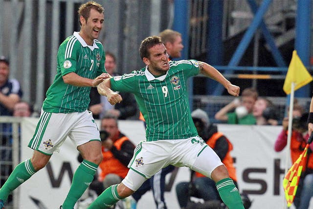 Northern Ireland’s Martin Paterson is congratulated by team-mate Niall McGinn after scoring the winner against Russia